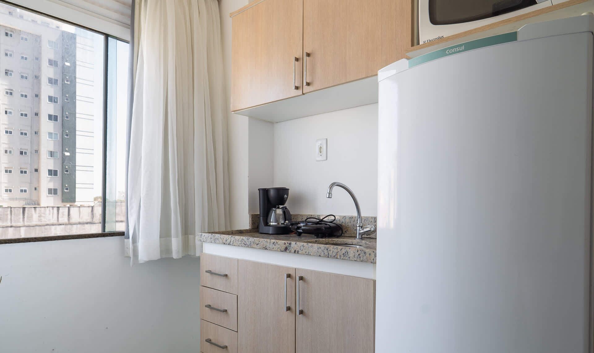 Fridge, microwave, cookware/dishes/utensils, dining tables