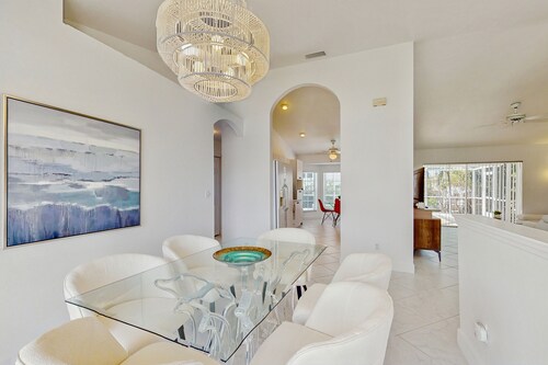 Coastal home with pool, lanai, and washer and dryer