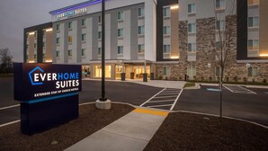 A hotel entrance with a sign for Everhome Suites, featuring a modern design with a stone facade and multiple windows. - Everhome Suites Clarksville Ft. Campbell Area by Choice Hotels (Clarksville)