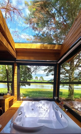 Interior. Experience moments of tranquility for two in a hot tub with a view of the stars.