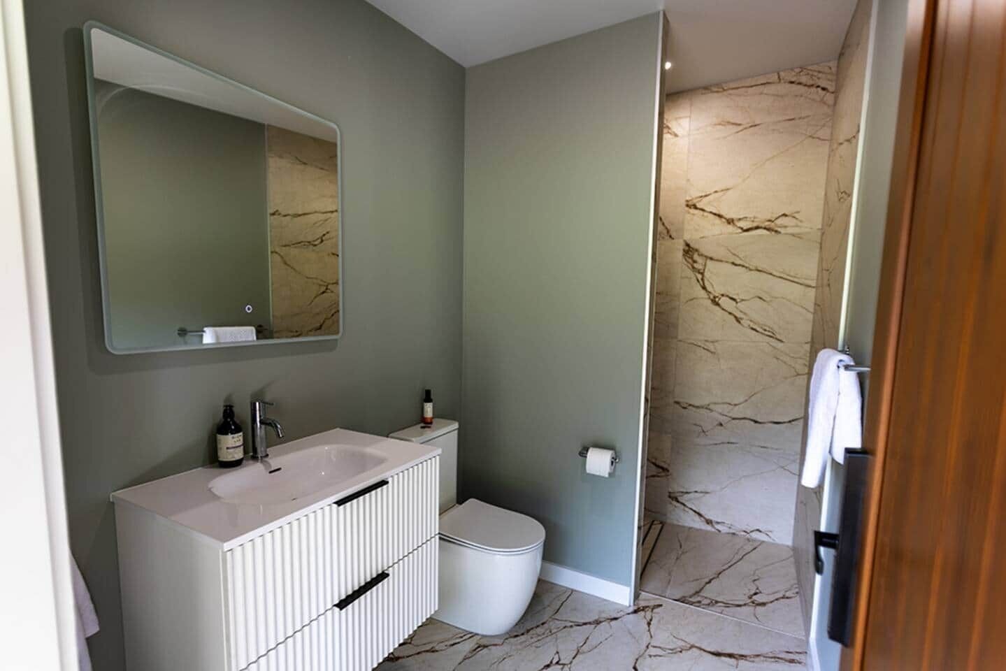Another extra large shower is found in the bathroom located off the bedroom in the sleepout.