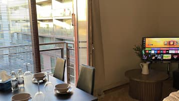 Comfort Apartment, Balcony, Garden View | Living area | Flat-screen TV