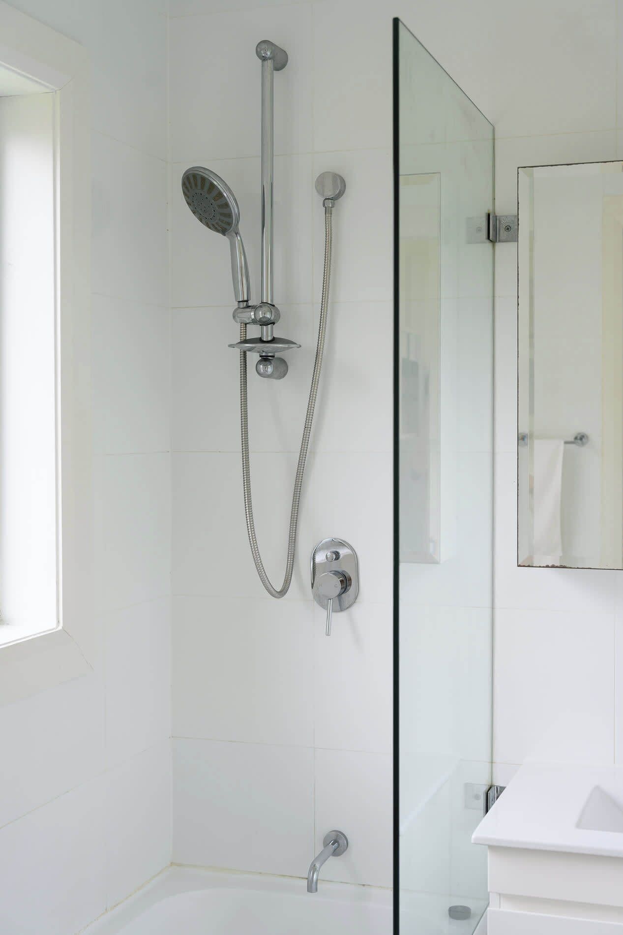 Shower, hair dryer, towels, shampoo
