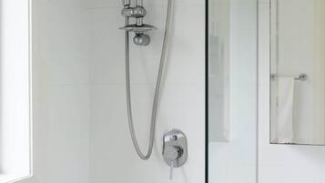 Shower, hair dryer, towels, shampoo