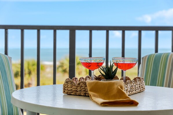 Outdoor dining - Beautiful Condo with Panoramic Ocean Views: Double‑Wide Balcony, Heated Pool & Hot Tub ☀️ (Cape Canaveral)