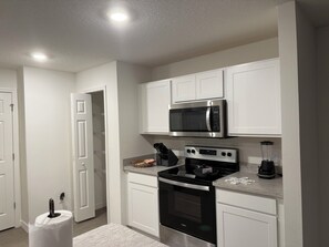 Fridge, microwave, oven, stovetop - Marvelous 4-bedroom modern home design with abundant space in sunny Palm Bay (Palm Bay)