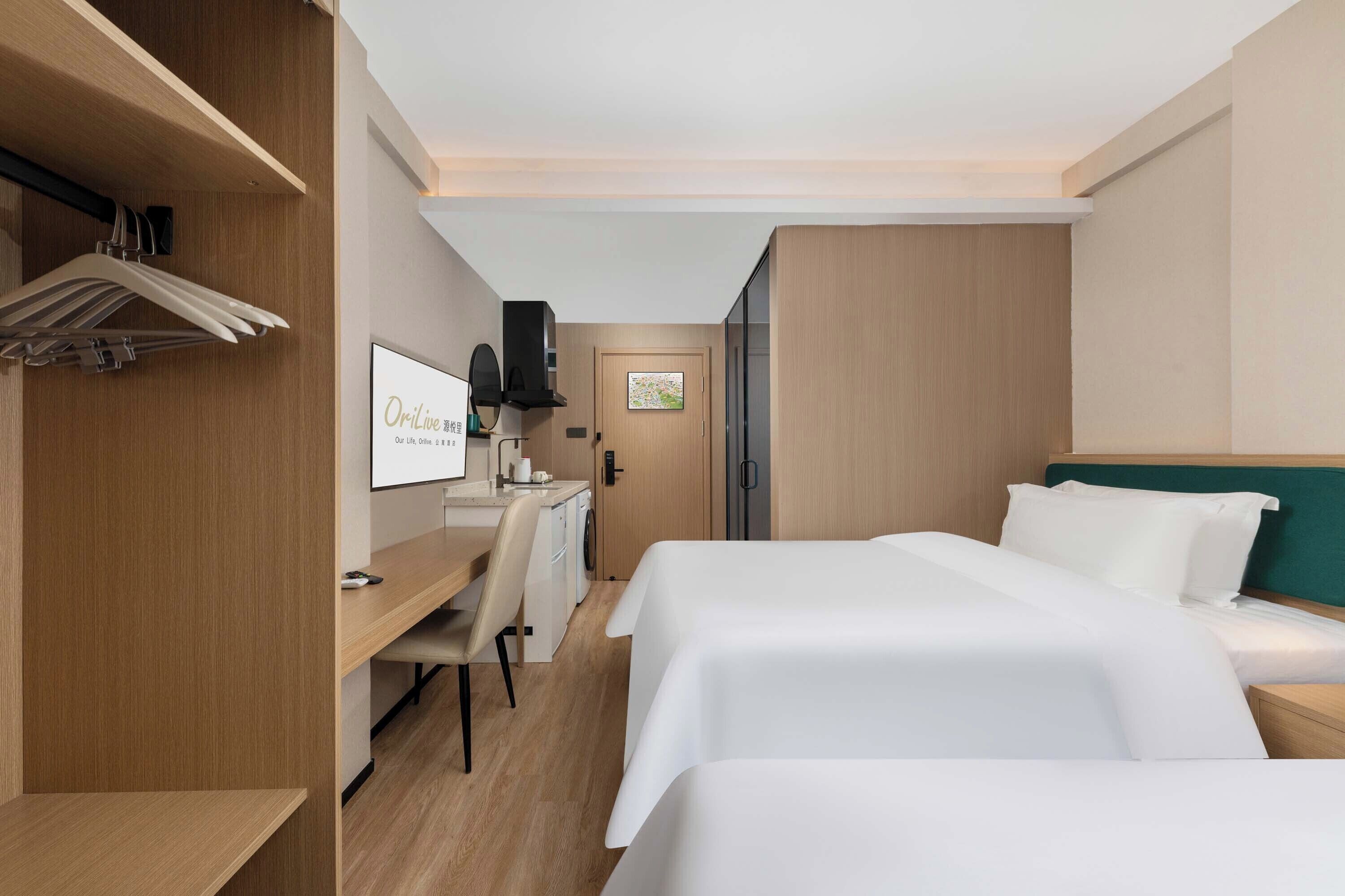 Luxury Twin Room, Hill View | Living area | TV, foosball, books