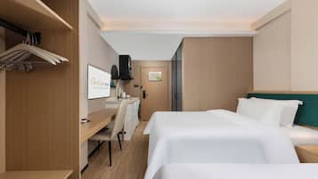 Luxury Twin Room, Hill View | Living area | TV, foosball, books