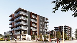 A modern multi-story residential building with balconies, a pedestrian crossing, and a street with people and vehicles. - Manchester Square Urban Stay – Easy To Everything (Christchurch)