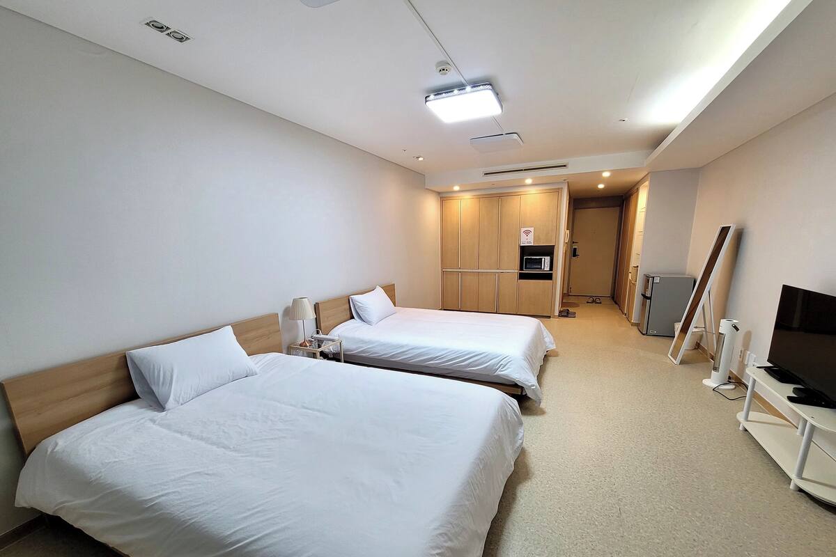 Standard Twin Room, City View | Desk, laptop workspace, blackout drapes, free WiFi