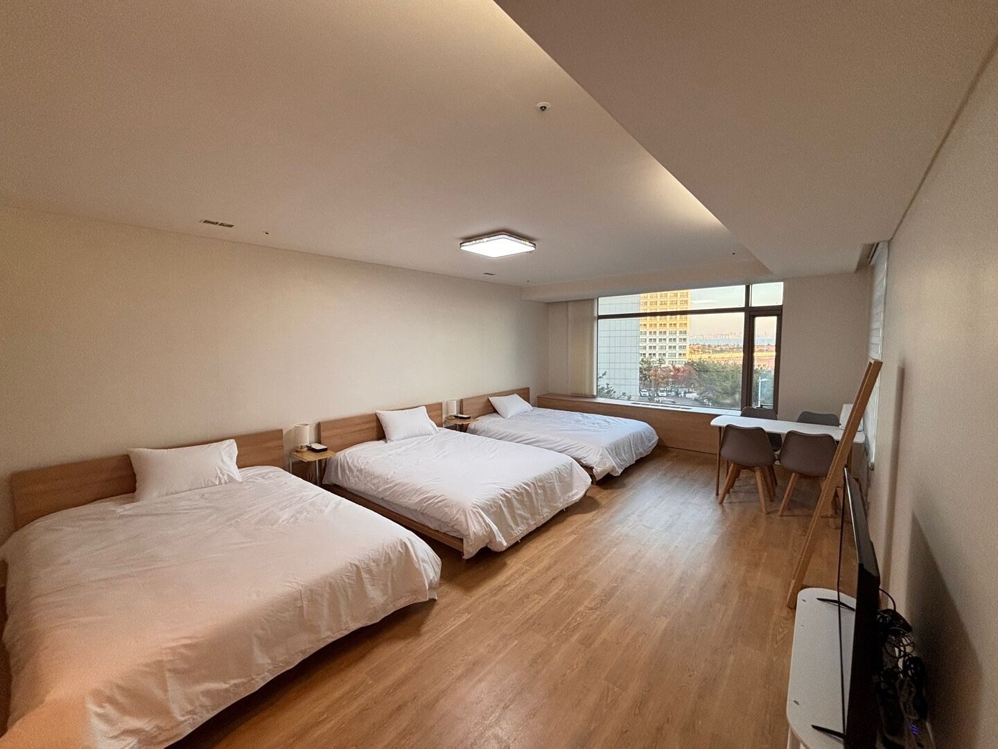 Family Triple Room, Partial Ocean View | Desk, laptop workspace, blackout drapes, free WiFi