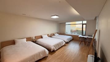 Family Triple Room, Partial Ocean View | Desk, laptop workspace, blackout drapes, free WiFi