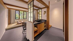 A modern bathroom with a wooden vanity, a large window, and a built-in mirror. - Shanjue Cultural Boutique Hotel-Nanbin (Chongqing)