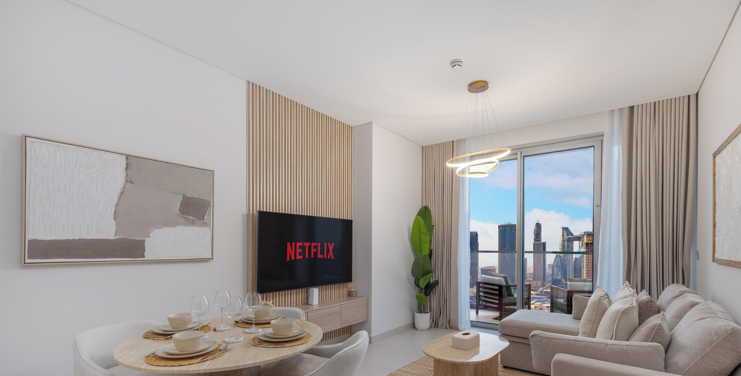 A modern living room with a flat-screen TV, dining area, and a large window with a city view.