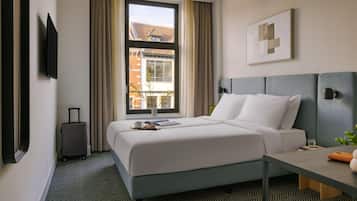 Een kluis op de kamer, verduisterende gordijnen, gratis wifi