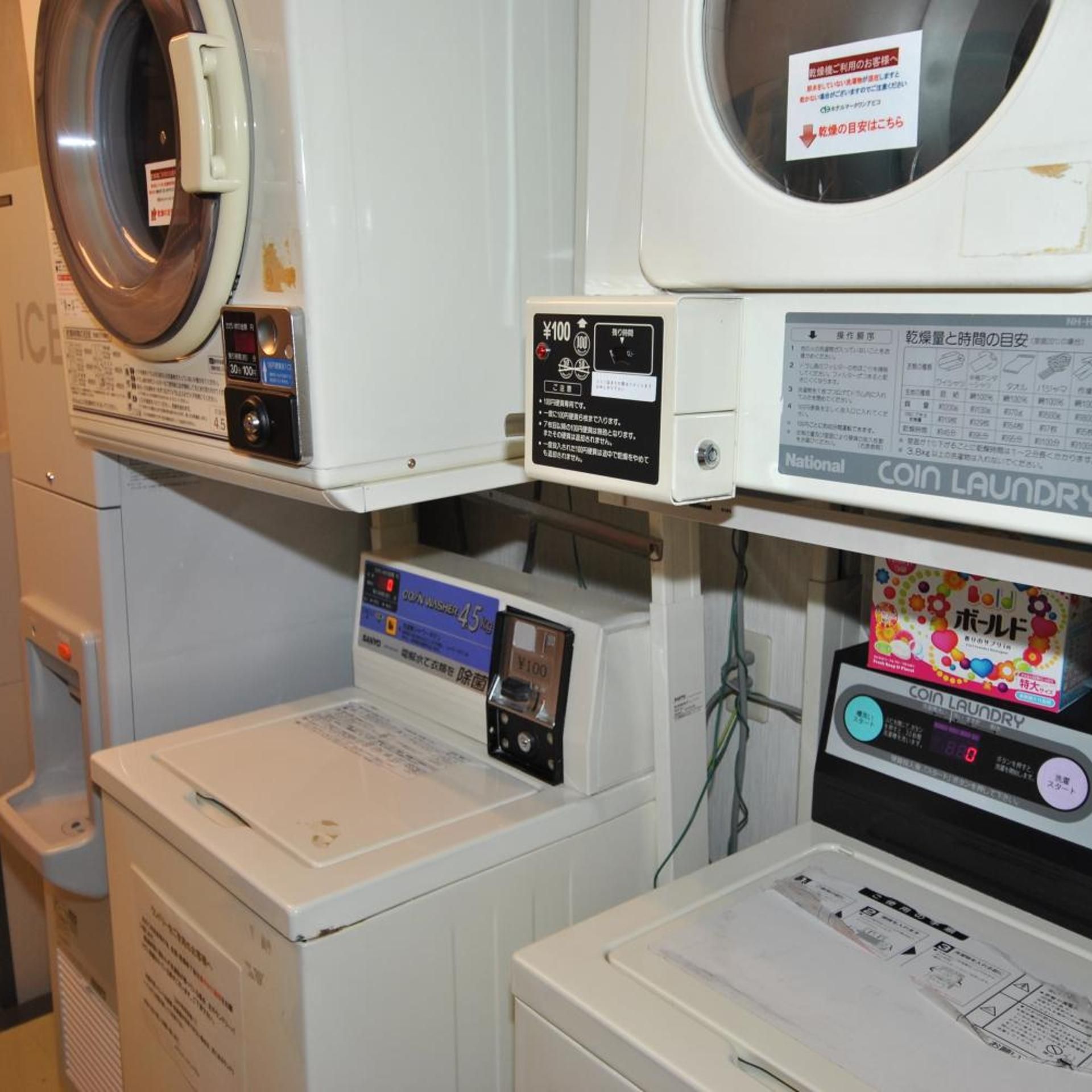 A laundry facility with coin-operated washers and dryers, a coin washer, and a coin dryer.