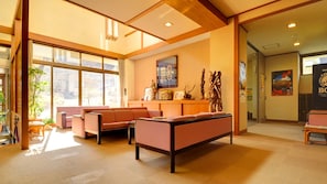 A spacious lobby with a reception desk, seating area, and large windows allowing natural light. - Nasuyumoto Onsen Ryokan Shimizuya (Nasu)