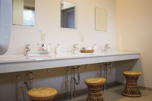 A bathroom with two sinks, mirrors, and three wicker stools. - Pica Resort Fuji Yoshida (Fujiyoshida)