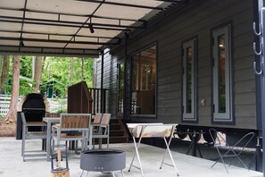 A covered patio with outdoor furniture, a grill, and a fire pit. - Pica Resort Fuji Yoshida (Fujiyoshida)