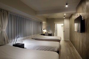 A hotel room with two beds, a desk, a chair, a TV, and a large window with curtains. - Shinjuku City Hotel N. U. T. S Tokyo (Tokyo)