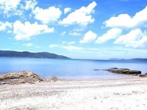 A beach with clear skies and calm water. - Marine Terrace (Tatsugo)
