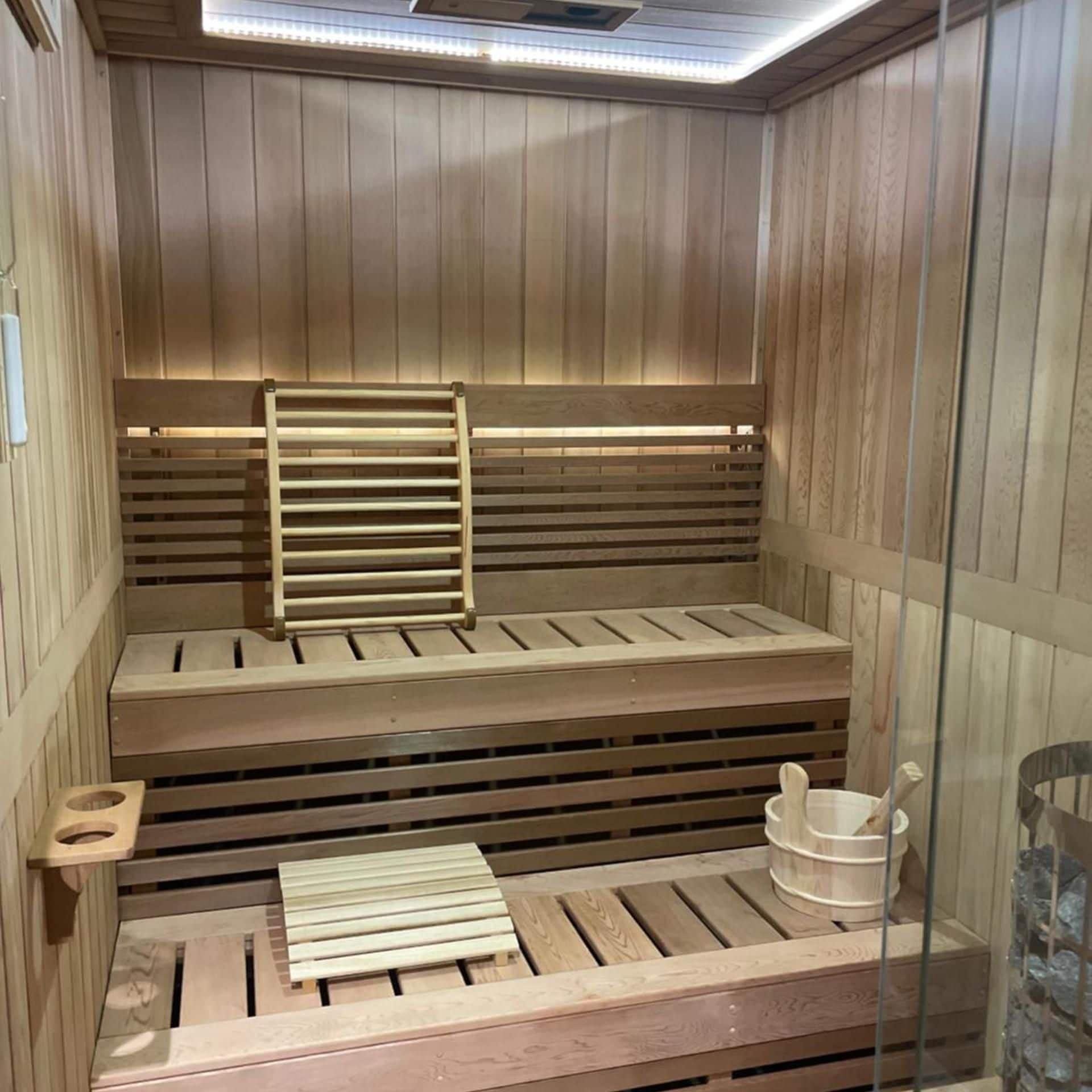 A sauna with wooden benches and a bench seat.