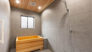 A modern bathroom with a wooden bathtub, a shower, and a window. - Vacation Rental Hitoritoiro (Annaka)