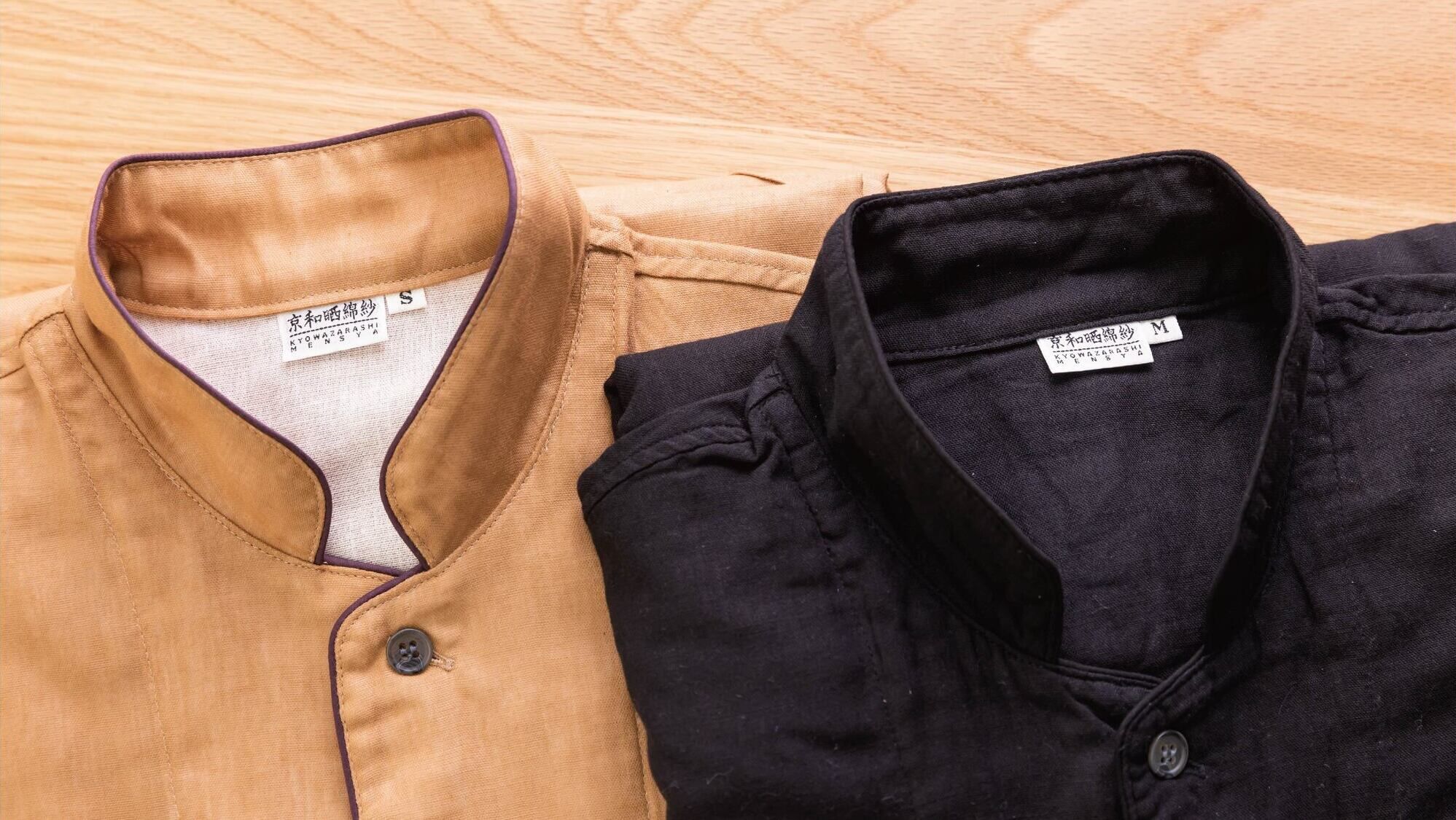 Two shirts, one in tan and one in black, with labels indicating they are from Kyoto and Osaka.