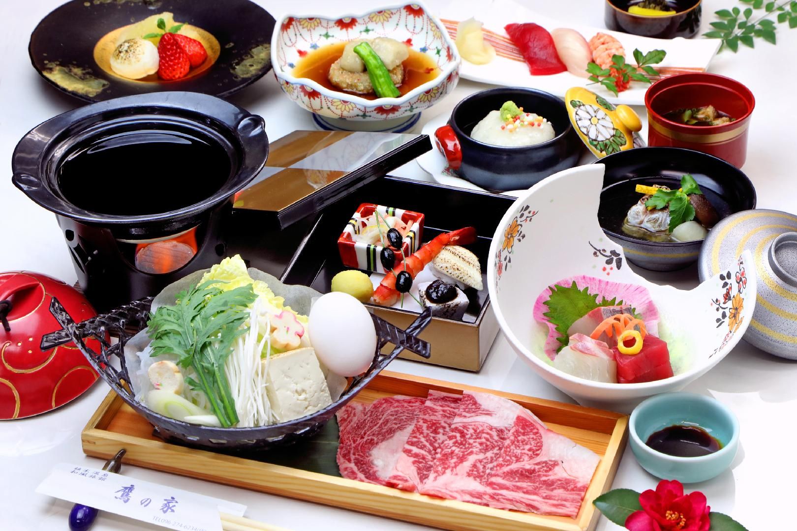 A variety of Japanese dishes and utensils on a table.