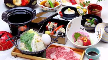A variety of Japanese dishes and utensils on a table.