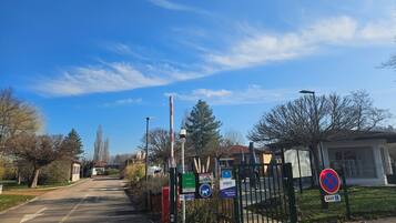 A gated entrance to a property with a clear sky.