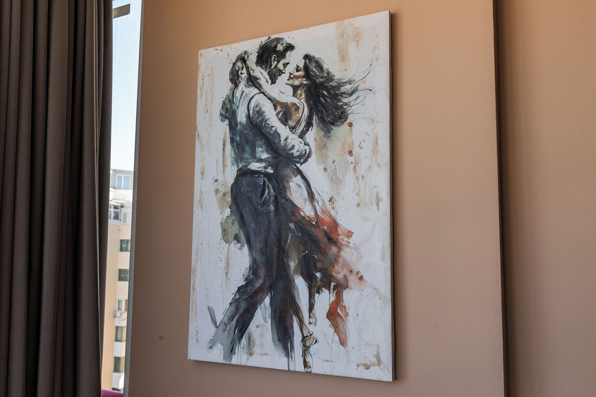 A painting of a couple embracing on a wall.