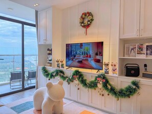 Deluxe Apartment, Beach View | Living area | 55-inch Smart TV with cable channels - CSJ TOWER (Vũng Tàu)