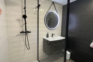 Shower, hair dryer, towels, soap