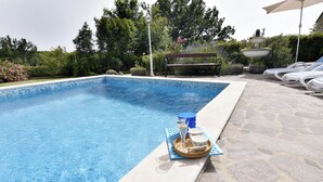 A swimming pool with a stone deck, a lounge area with sun loungers, and a fountain. - Villa With Private Pool and Garden Retreat (Groznjan)
