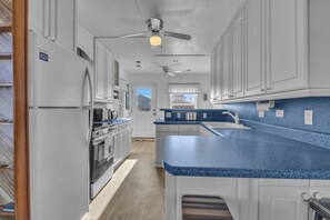 Fridge, microwave, oven, stovetop - Bumblebee House | Topsail Beach, NC | Pet Friendly | Sleeps 8 (Topsail Beach)