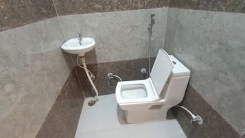 Shower, rainfall showerhead, bidet, towels