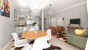 Una sala de estar moderna con comedor, cocina y televisor.