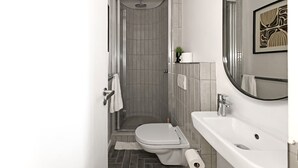 Un baño moderno con ducha, inodoro y lavabo.