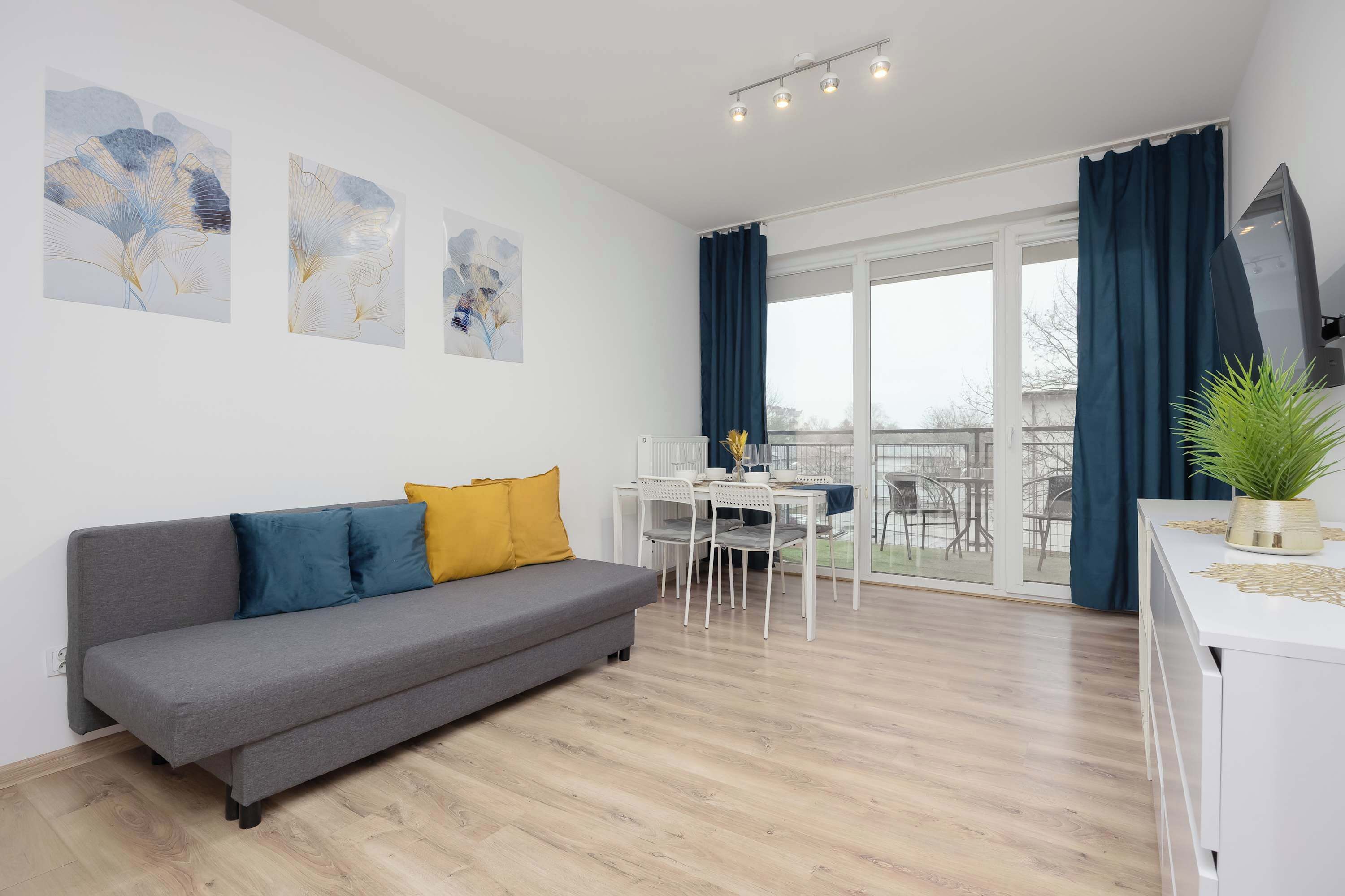 Relax in the stylish living room with a comfortable sofa and modern decor.