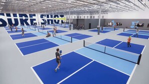 A multi-sport indoor facility with multiple courts, including a tennis court and a badminton court. - Near to Riverwalk | Indoor Pool + Free Breakfast (Naperville)