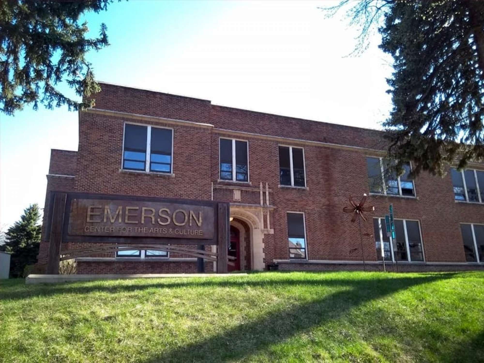 A brick building with a sign reading "Emerson Center for the Arts & Culture."