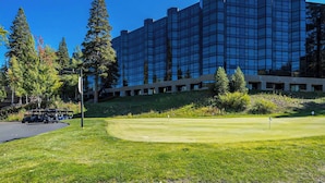A golf course with a modern building in the background. - Olympic Valley Studio For Summer: Everline Resort! (Olympic Valley)