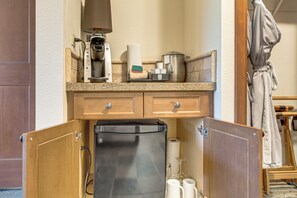 A kitchen with a coffee maker, paper towel holder, and a refrigerator. - Hike, Ski & Ice Skate! Everline Resort Studio (Olympic Valley)