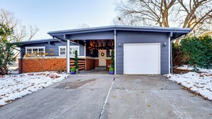 A modern house with a garage, a brick exterior, and a covered entryway. - Spacious & Family Friendly! Lincoln Home Near Dtwn (Lincoln)