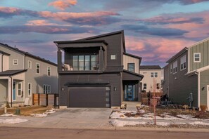 A modern two-story house with a garage, large windows, and a flat roof. - Ski Chalet Chic Retreat With Hot Tub (Park City)
