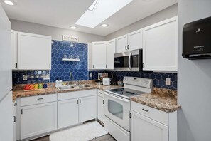 House, 4 Bedrooms | Private kitchen | Oven, coffee/tea maker, toaster - Pet Friendly Lansing Home - Private Gym - Near MSU (Lansing)