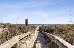 A sandy beach path with wooden railings leading to the sea. - Ocean View 3 Bedroom Home - Pet Friendly (Fernandina Beach)