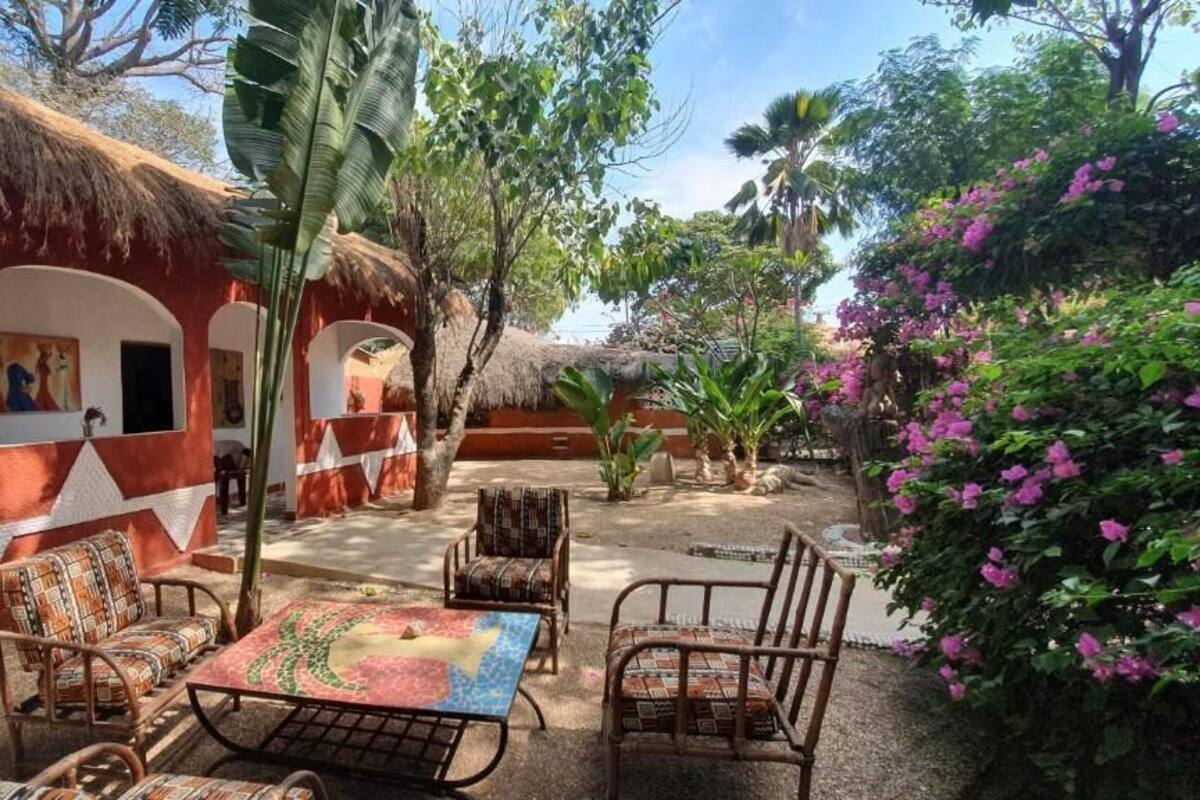 Chambre triple, patio, vue sur le jardin | Terrasse/patio