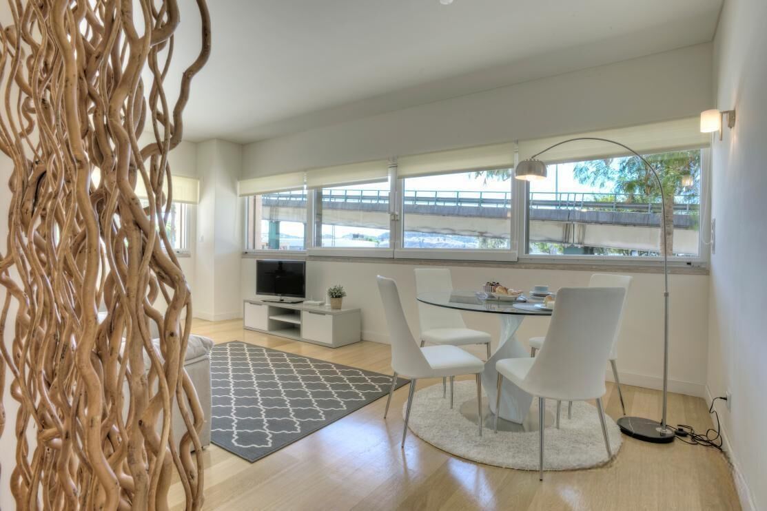 Deluxe Apartment | Living area | 31-inch TV with cable channels